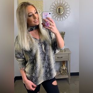 BIBI- Snakeskin print sweater knit top with Batwing sleeves SIZE SMALL